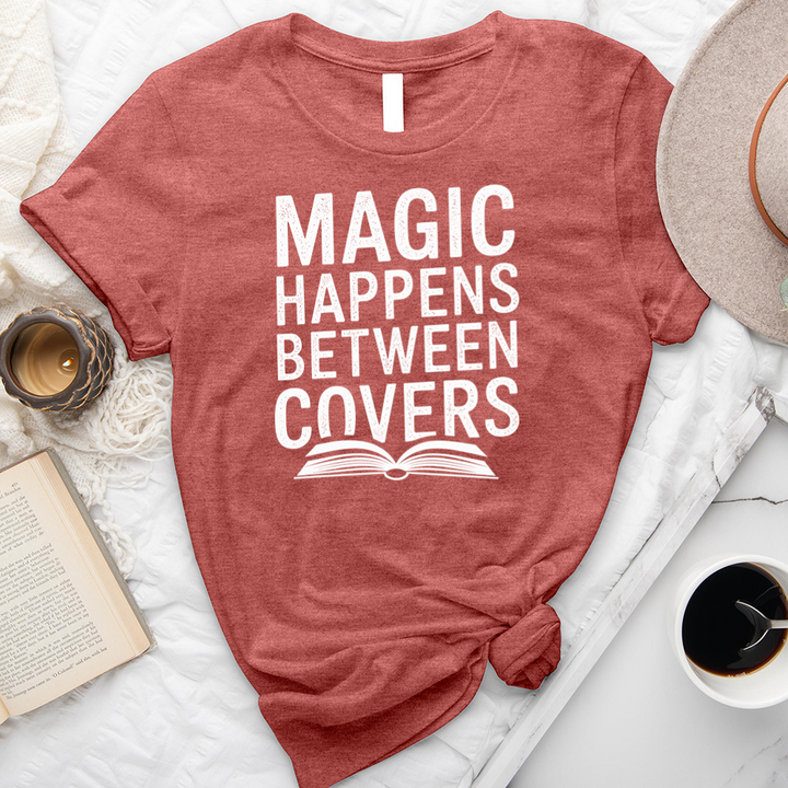 magic happens between covers unisex tee