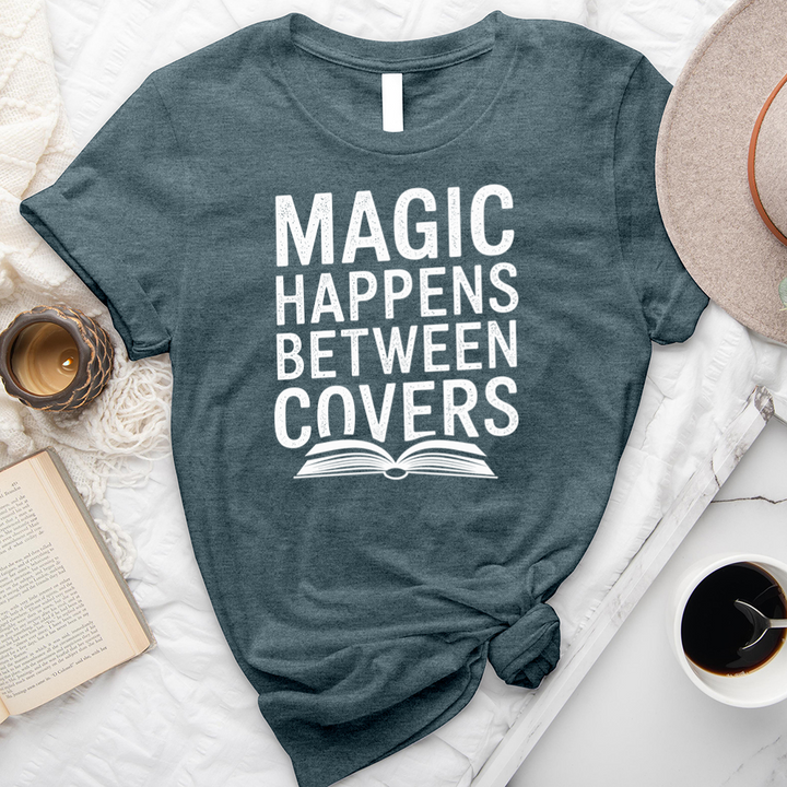 magic happens between covers unisex tee