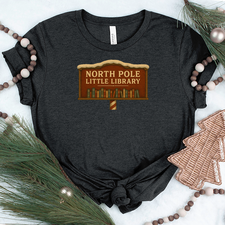 north pole little library sign unisex tee