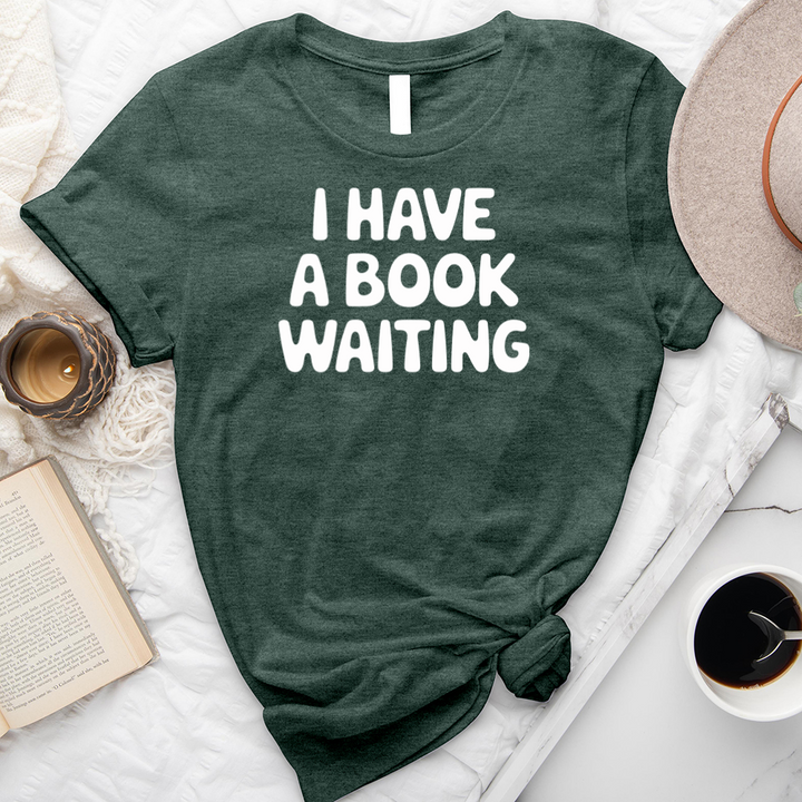 I have a book waiting unisex tee