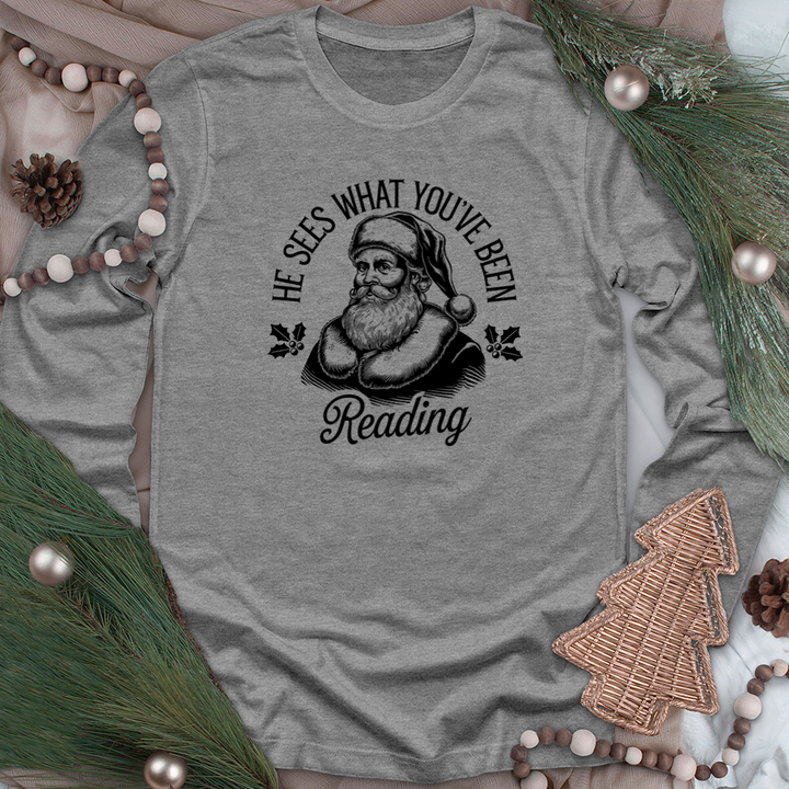 he sees what you've been reading long sleeve unisex tee