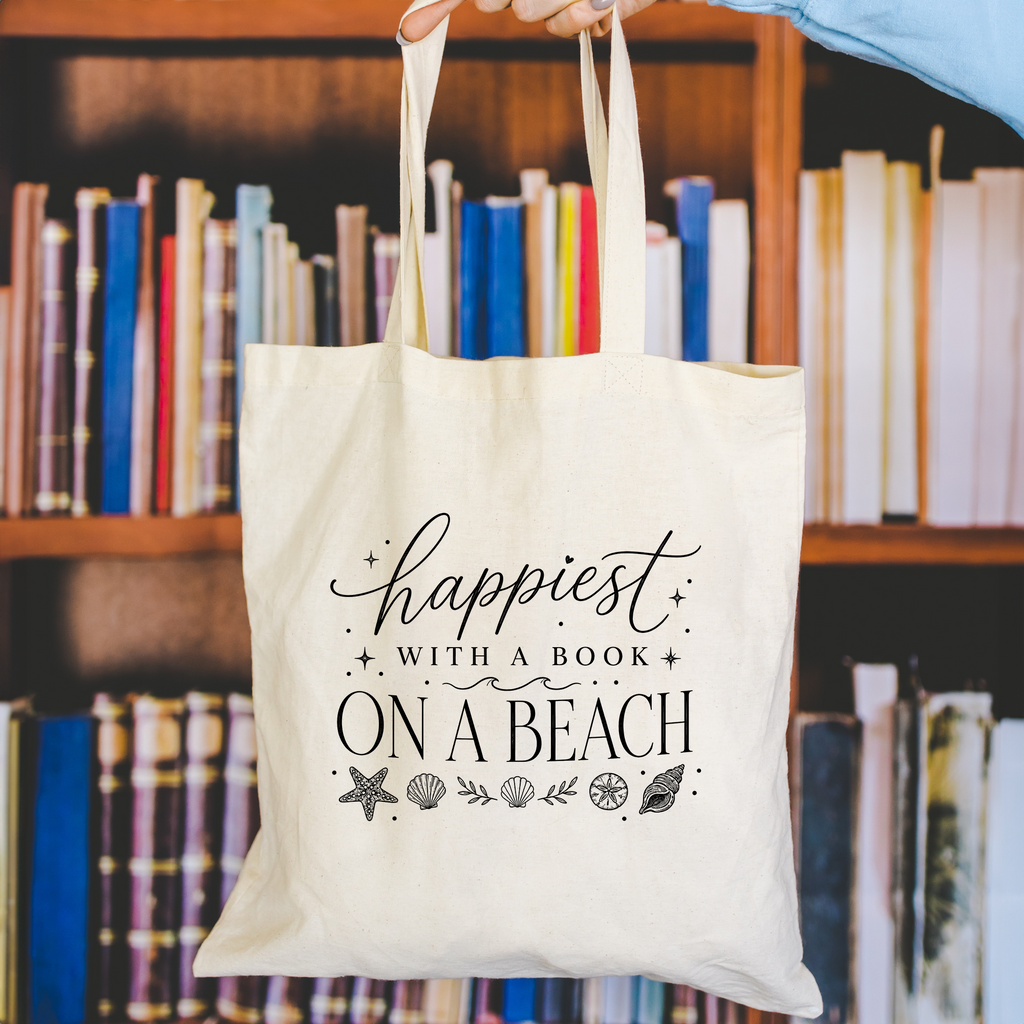 happiest with a book on a beach tote bag