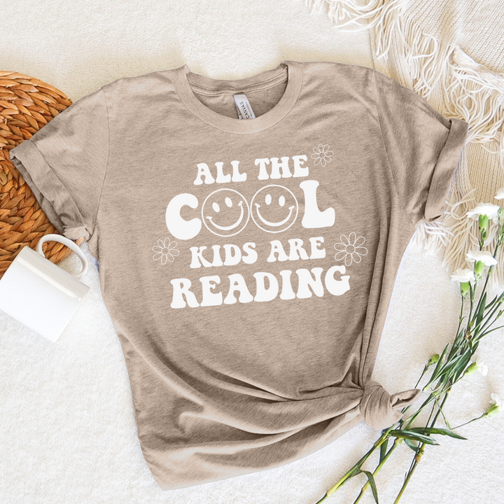 all the cool kids are reading unisex tee